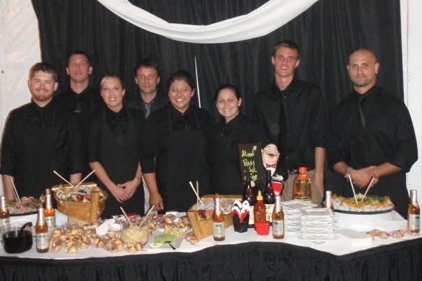 WR Bar Enterprises bartending and service team behind a catered event table